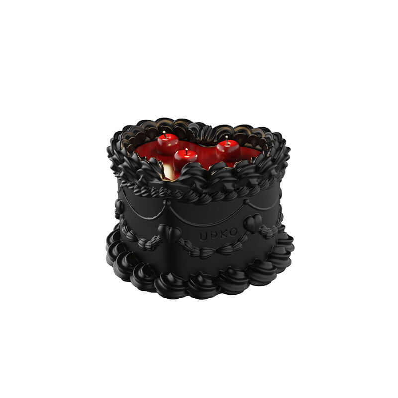 Midnight Sweetie low-temperature wax candle designed to look like a cake, featuring red and black colors with cherry details.