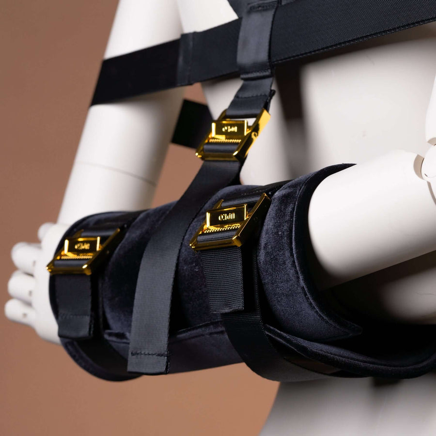 Simplified Takate Kote Set straps on a mannequin showcasing sleek design and adjustable features for BDSM play.