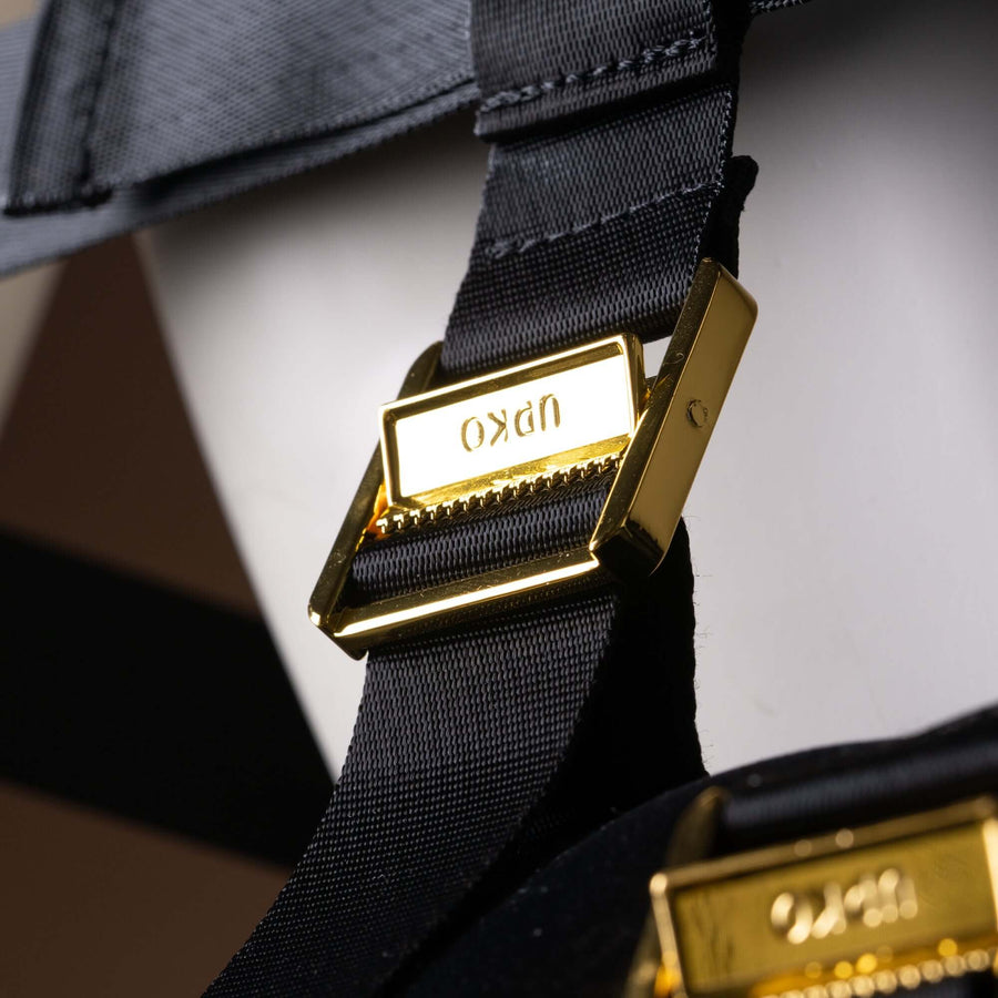 Close-up of UPKO Simplified Takate Kote Set's black strap with gold buckle, showcasing detailed craftsmanship and design.